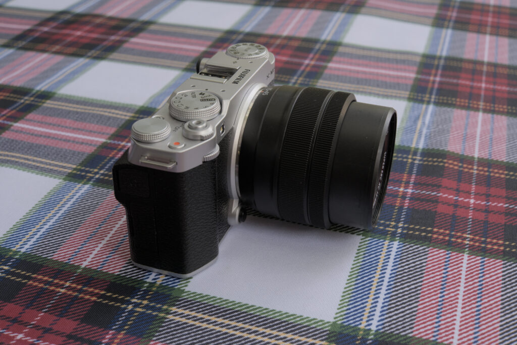 The Fujinon XC14-45 lens mounted on the Fujifilm X-M5. The from is extended being 1/3 of the length of the lens.